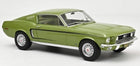 Green 1:18 scale diecast model car, classic fastback, detailed collector's item on white background