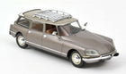Diecast model car in metallic brown, vintage wagon with roof rack, 1:18 scale collectible.