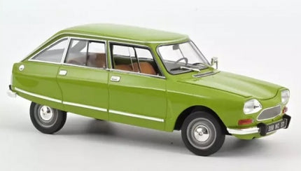 Green diecast model car 1:18 scale, vintage four-door sedan with detailed exterior.
