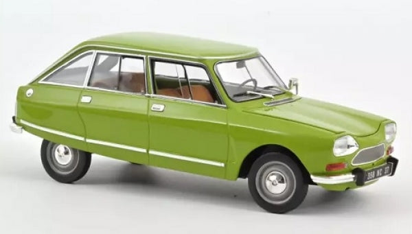 Green diecast model car 1:18 scale, vintage four-door sedan with detailed exterior.