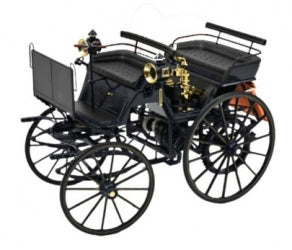 Diecast model of a vintage black car with brass details and large spoked wheels