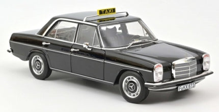 Black diecast model classic Mercedes taxi car with roof sign on white background