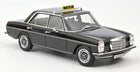 Black diecast model classic Mercedes taxi car with roof sign on white background