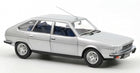 Silver diecast model car, 1:18 scale, four-door sedan with detailed wheels and blue interior.