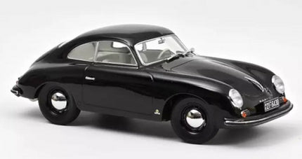 Black diecast 1:18 scale model car with classic coupe design on white background
