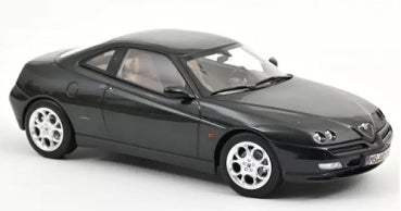 1:18 scale black diecast model sports car with silver rims on white background