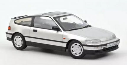 1:18 scale silver diecast model car with black trim, three-door hatchback, on white background