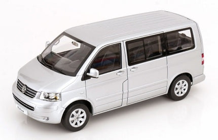 Silver 1:18 scale diecast model van with detailed exterior and black trim