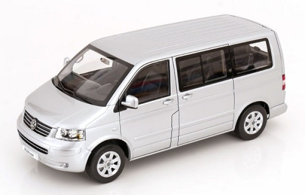 Silver 1:18 scale diecast model van with detailed exterior and black trim
