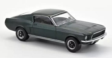 Green diecast model car in 1:43 scale, classic coupe design, white background.