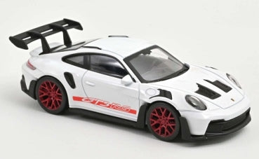 White diecast Porsche 911 GT3 RS model car with red wheels, black spoiler, 1:18 scale