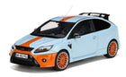 1:18 scale diecast model car, blue with orange racing stripes and accents, sporty hatchback design