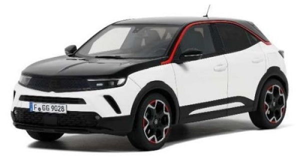 1:18 scale diecast model car in white and black with red accents, modern SUV design