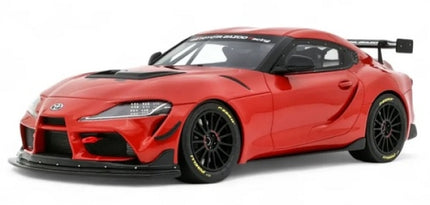 Red diecast Toyota Supra model car with black wheels and rear spoiler, 1:18 scale