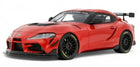 Red diecast Toyota Supra model car with black wheels and rear spoiler, 1:18 scale