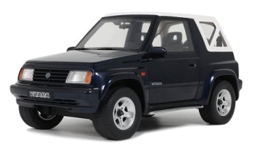 1:18 scale diecast model car, black Suzuki Vitara SUV with white roof, on white background