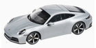 Silver Porsche 911 diecast model car 1:18 scale with black roof and detailed rims