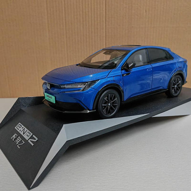 Honda e:NP2 2024 Silver Original Manufacturer 1:18 Diecast Model Car - studio product photo of the scale model