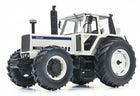 Diecast model of a white Lamborghini 1556 tractor with large black tires, 1:18 scale.