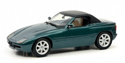 1:18 scale green diecast convertible model car with black roof, detailed wheels, and realistic interior