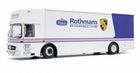 Diecast model of a white Mercedes Porsche team truck with Rothmans livery and detailed decals.
