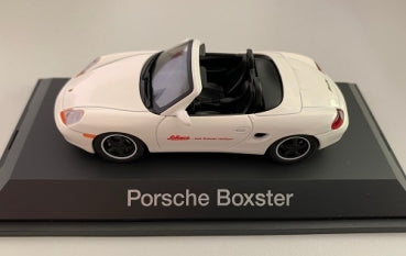 White Porsche Boxster diecast model car on display stand, convertible, 1:43 scale