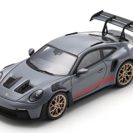 1:18 scale grey Porsche GT3 RS diecast model car with large rear wing and gold wheels