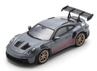 1:18 scale grey Porsche GT3 RS diecast model car with large rear wing and gold wheels
