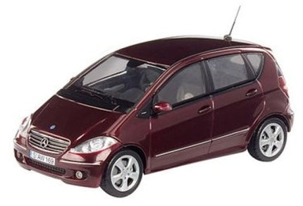 Red diecast model car in 1:18 scale, Mercedes-Benz compact hatchback, detailed exterior