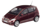 Red diecast model car in 1:18 scale, Mercedes-Benz compact hatchback, detailed exterior