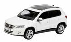 1:18 scale white SUV diecast model car with black roof and silver wheels