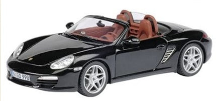 Black Porsche convertible 1:18 scale diecast model car with red interior, silver rims
