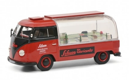 Red and black Schuco diecast model van with clear display case and detailed interior scene