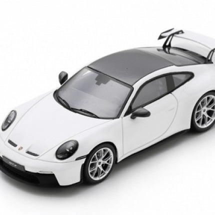 White 1:18 scale diecast sports car model with rear spoiler and black roof