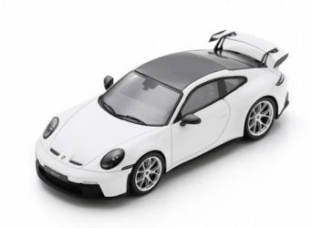 White diecast model car with black roof and rear wing, detailed 1:18 scale sports car.