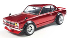 Red diecast model car with black fender flares and chrome wheels on white background