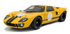 Yellow 1:18 scale diecast model car with black racing stripes and vintage design