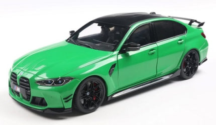 Green diecast model car, 1:18 scale, modern sports sedan with black accents and detailed wheels