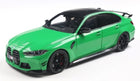 Green diecast model car, 1:18 scale, modern sports sedan with black accents and detailed wheels
