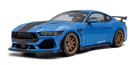 Blue 1:18 scale diecast Shelby model car with black racing stripes and gold wheels