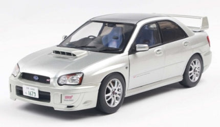 1:18 scale silver Subaru Impreza diecast model car with rear spoiler and detailed wheels