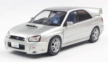 1:18 scale diecast silver Subaru Impreza WRX STI model car with rear spoiler