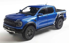 Blue diecast model pickup truck in 1:18 scale, detailed Ford Raptor miniature.