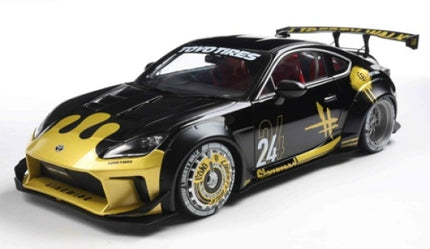 1:18 scale diecast sports car model, black and gold, racing decals, rear spoiler