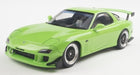 Lime green diecast model car with rear spoiler, black rims, 1:18 scale sports car
