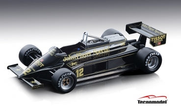 Black and gold 1:18 scale Formula 1 diecast model car with sponsor decals