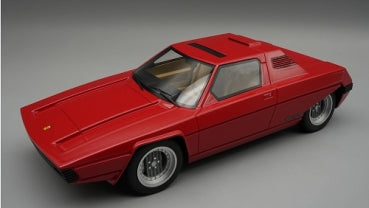 Red diecast model car in 1:18 scale with detailed wheels and windows on grey background