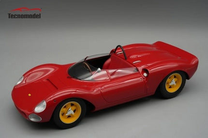 Red 1:18 scale diecast classic race car with yellow wheels and open cockpit on gray background