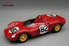 Red diecast model race car with number 482, yellow wheels, open cockpit on gray background