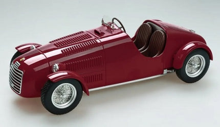 Red vintage diecast model car with wire wheels and brown seats, 1:18 scale collectible